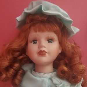 Red head porcelain doll